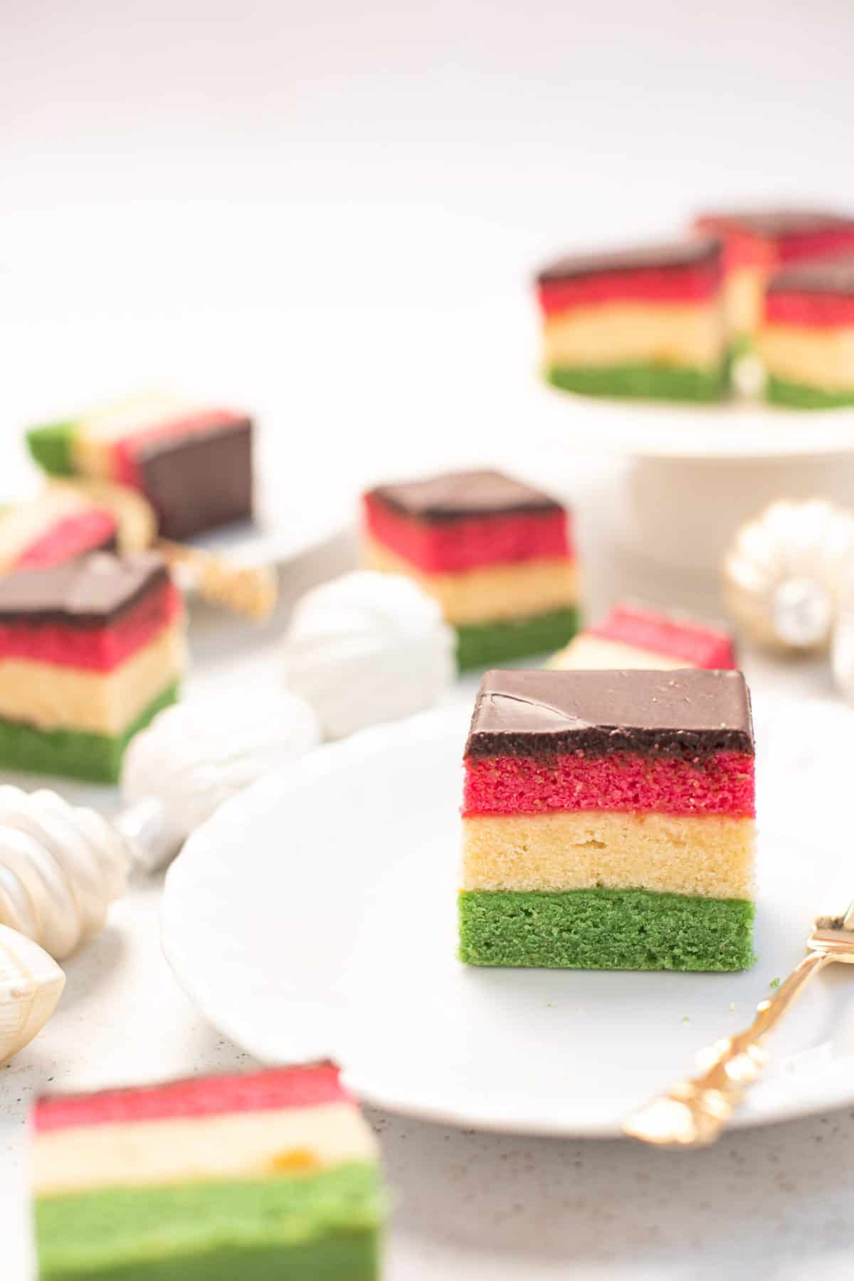 slices of rianbow gluten free cookies on white plates