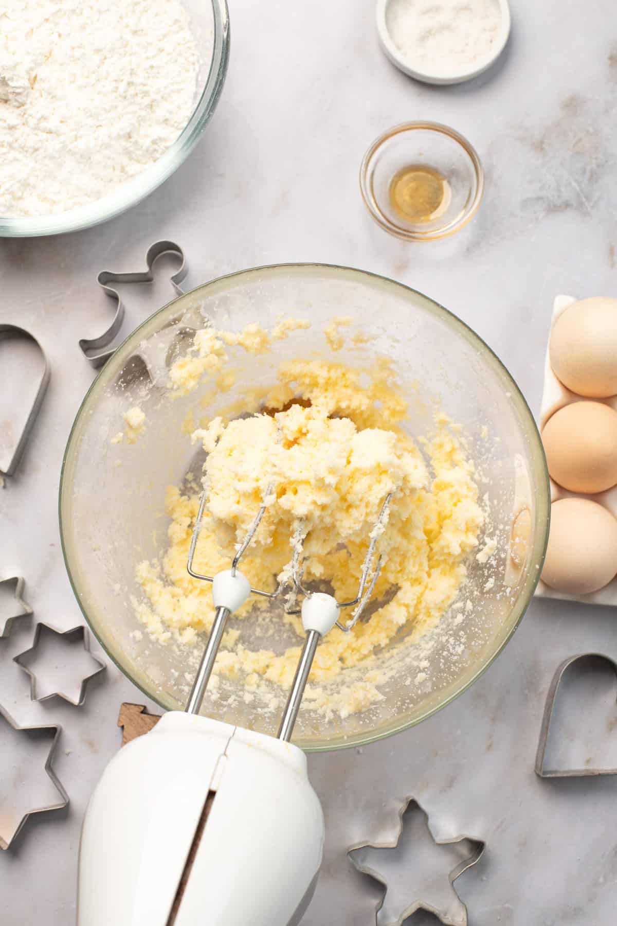 mixing butter and sugar with whisks for cookie dough