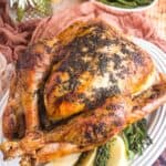 whole herb roasted turkey on a serving platter