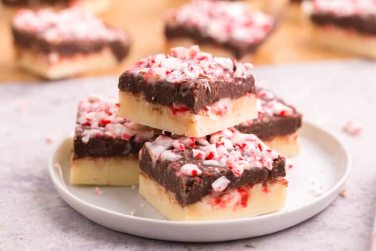 white and dark chocolate peppermint fudge in a small stack on a plate