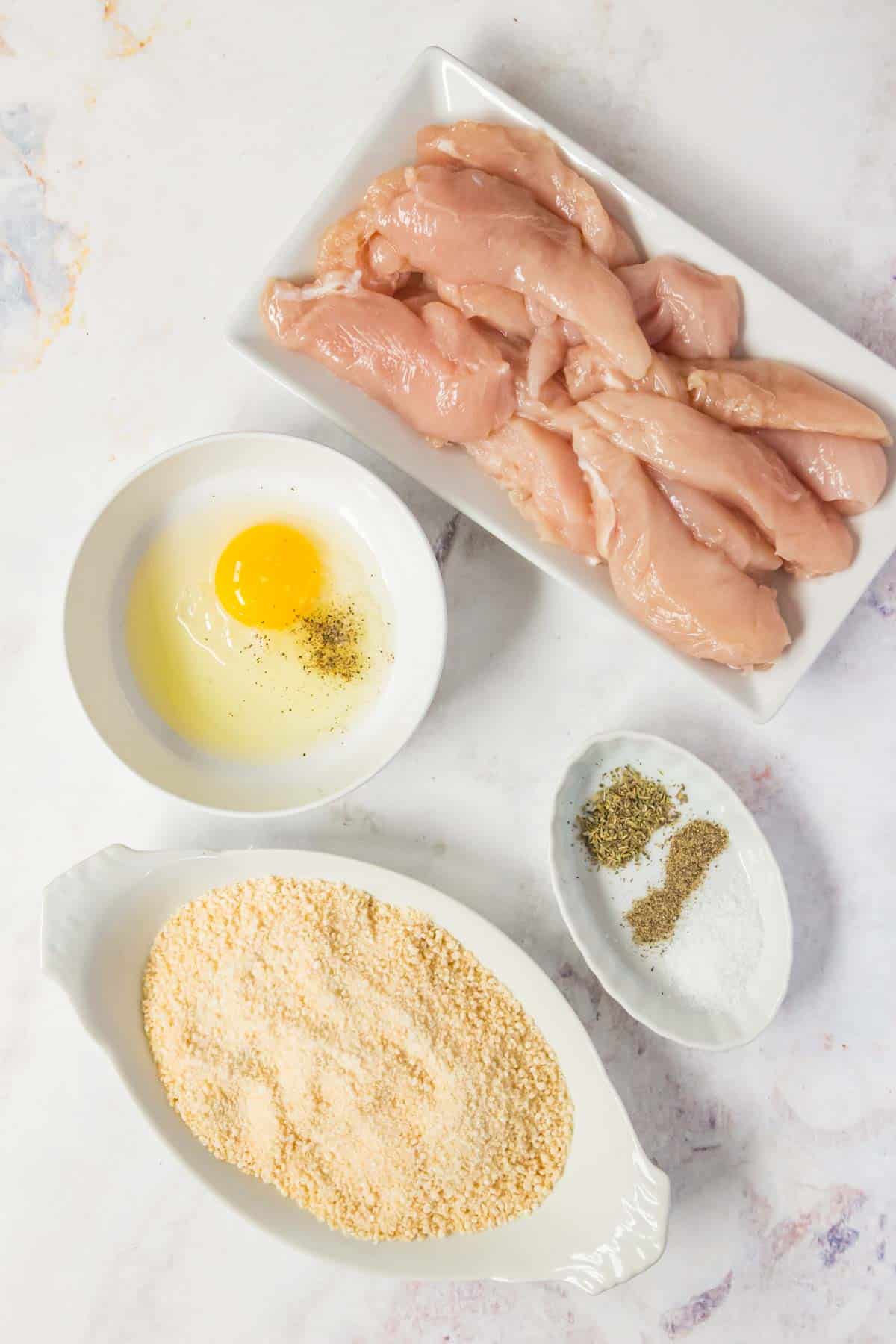 The ingredients for crispy gluten free chicken tenders.