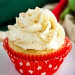 eggnog cupcake in a red wrapper on a white plate