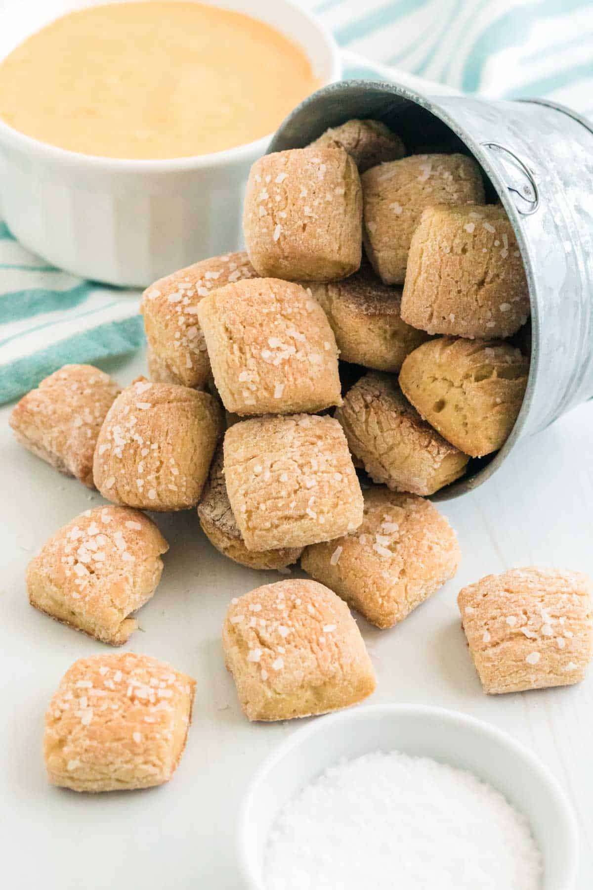 Pretzel nuggets spilling out of an overturned bowl.