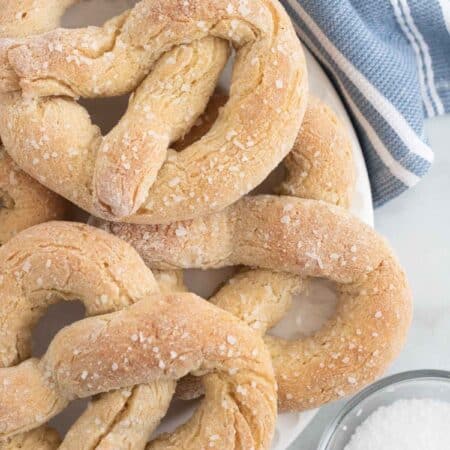 Gluten free soft pretzels on a plate.