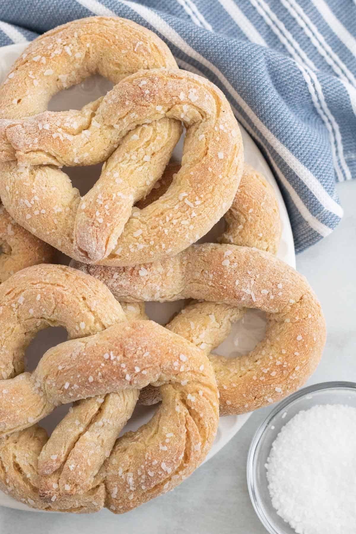 Gluten free soft pretzels on a plate.