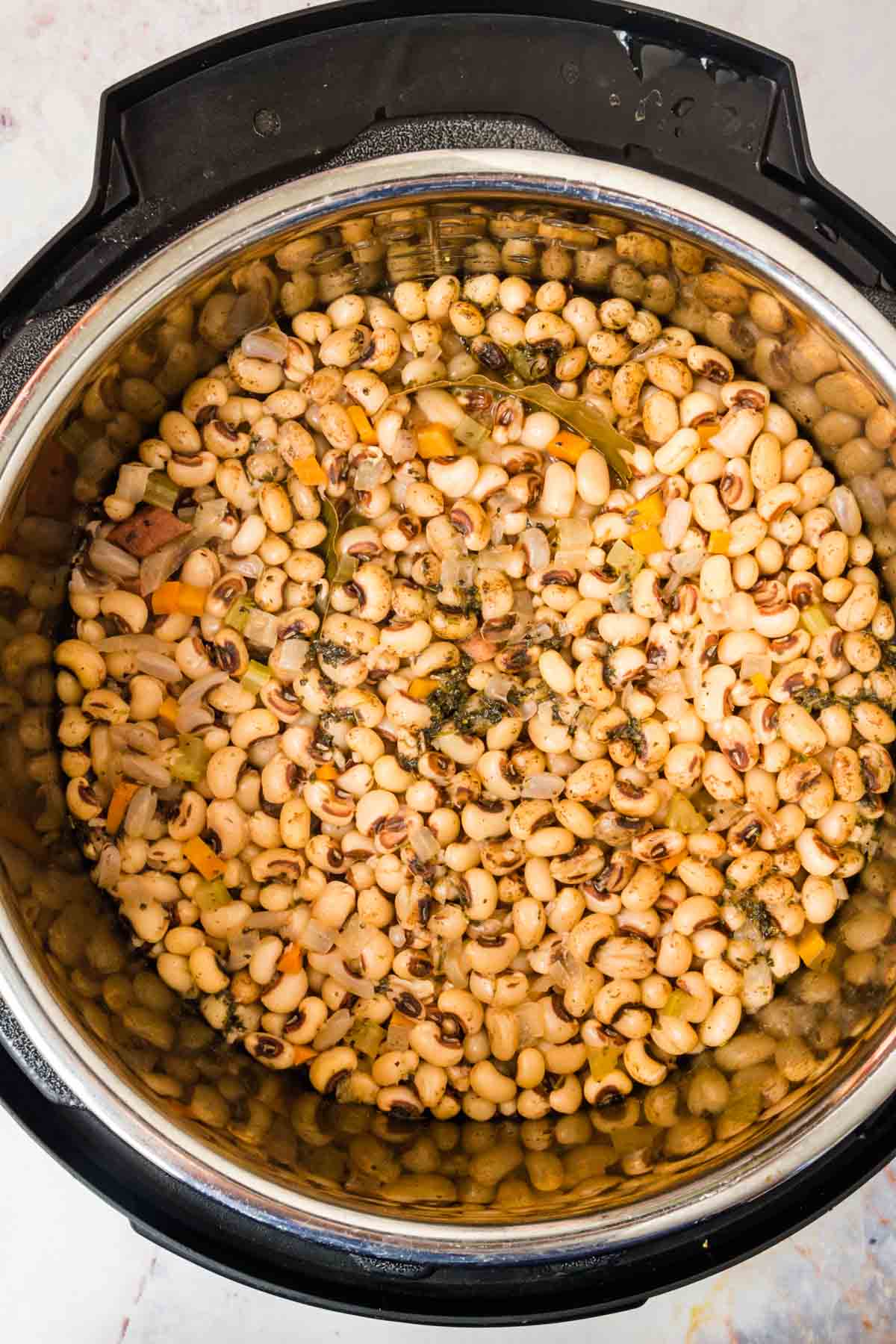Pressure cooked black eyed peas in the bowl of an Instant Pot.