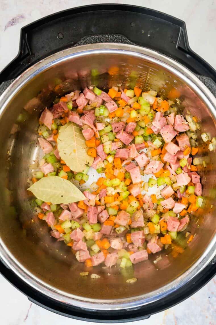 The ingredients for black eyed peas cooking in an Instant Pot.