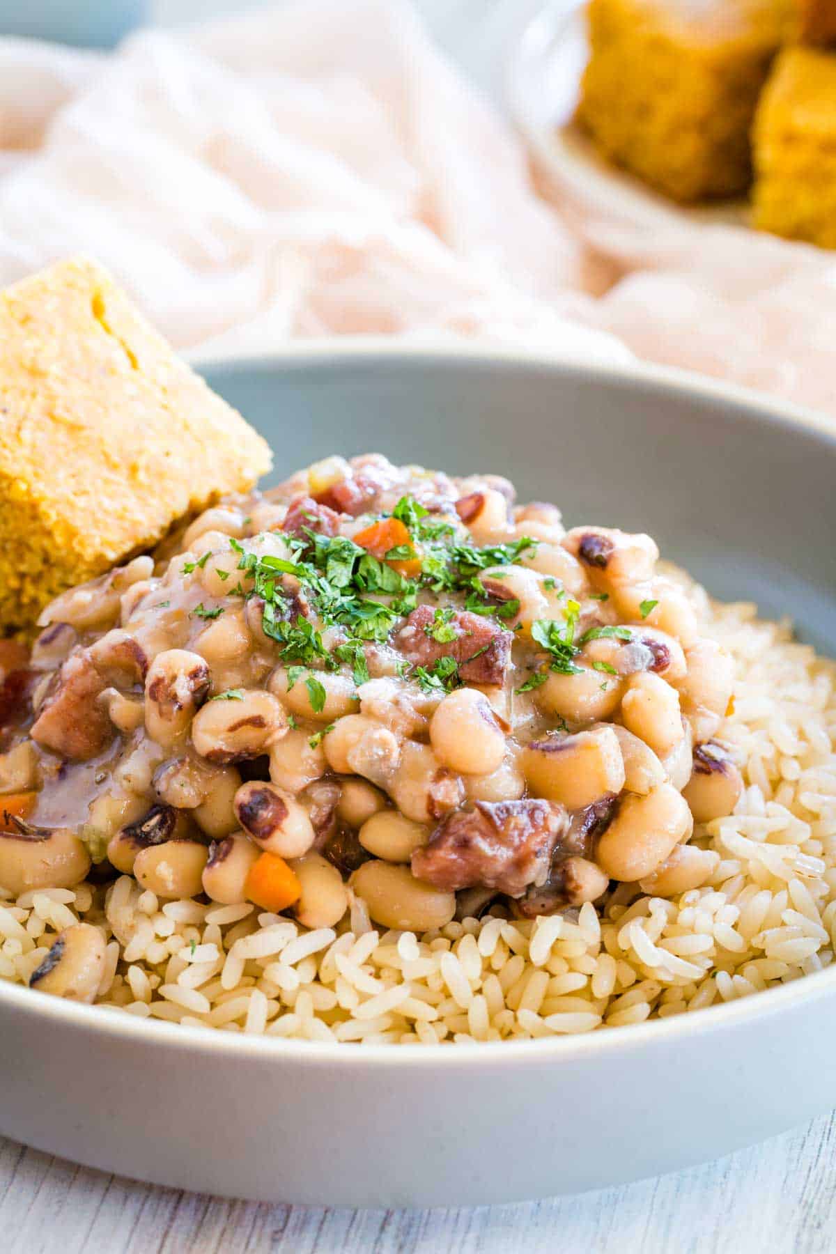 Black eyed peas served over rice, with a side of cornbread.