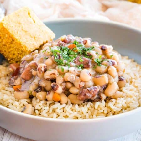 Black eyed peas served over rice, with a side of corn bread.