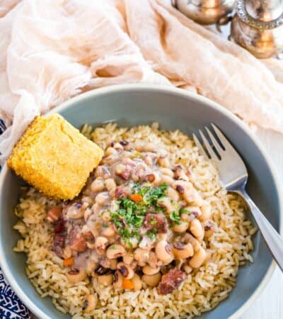 Black eyed peas served over rice, with a side of corn bread.