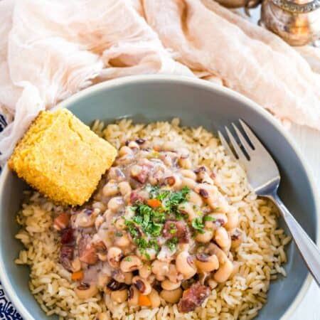 Black eyed peas served over rice, with a side of corn bread.