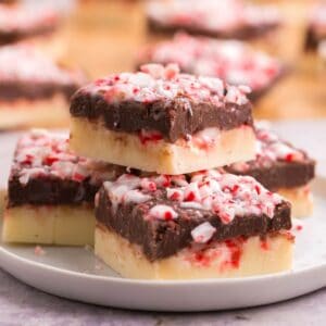 a plate of layered peppermint fudge on a plate
