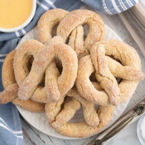 Gluten Free Soft Pretzels stacked up on a plate.