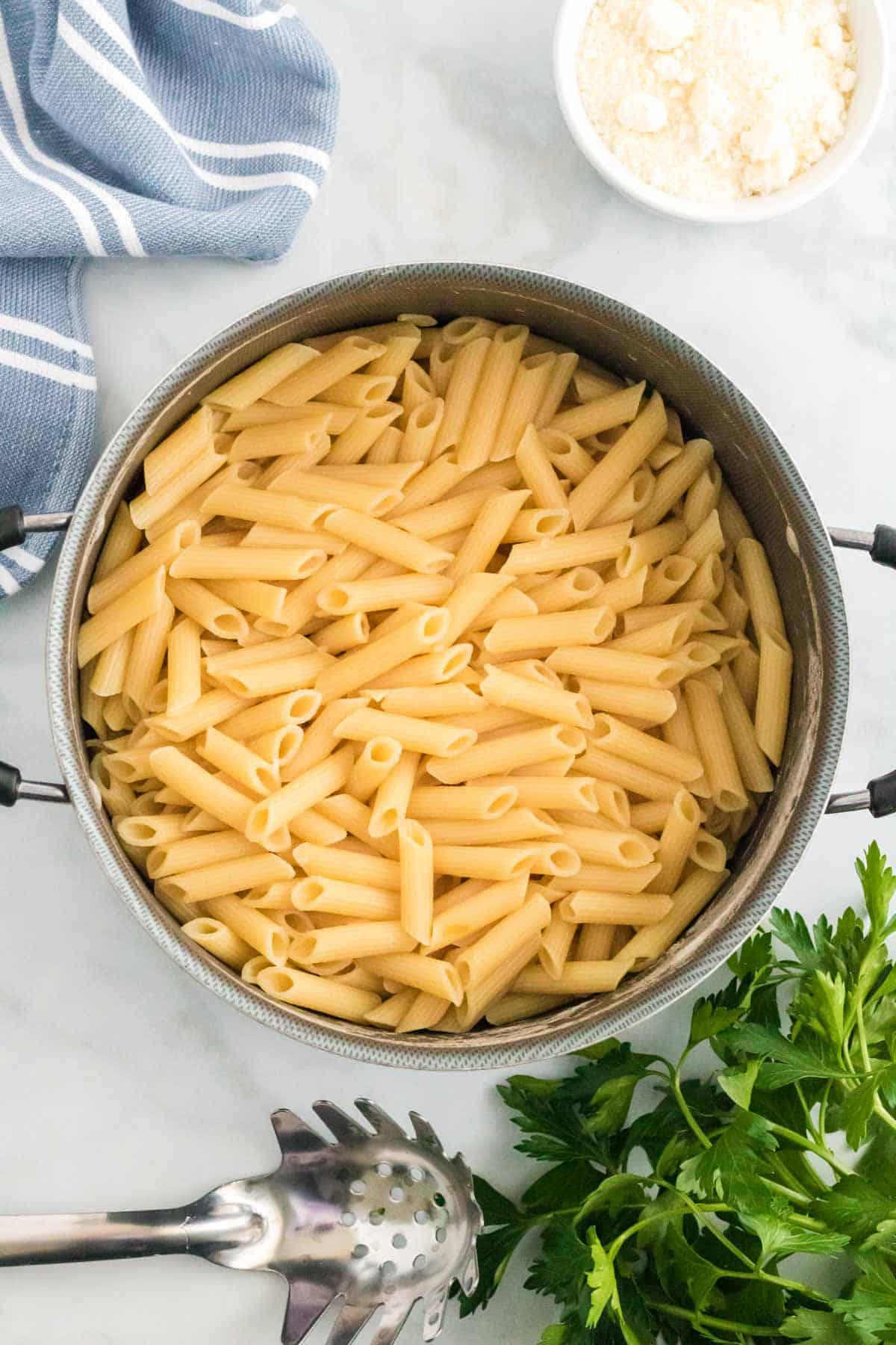 Cooked ziti pasta in a pot.