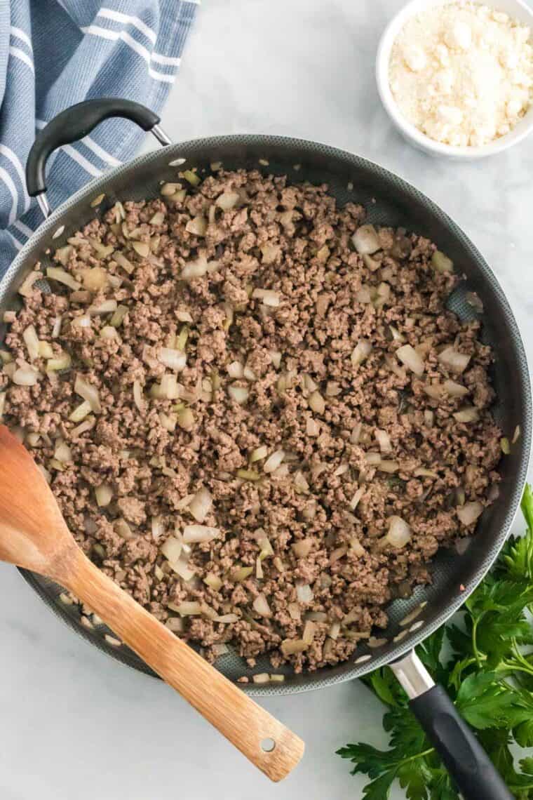 Ground beef is browned in a skillet.