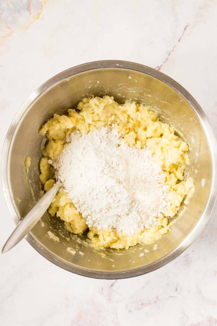Flour is added to the potato and egg mixture.