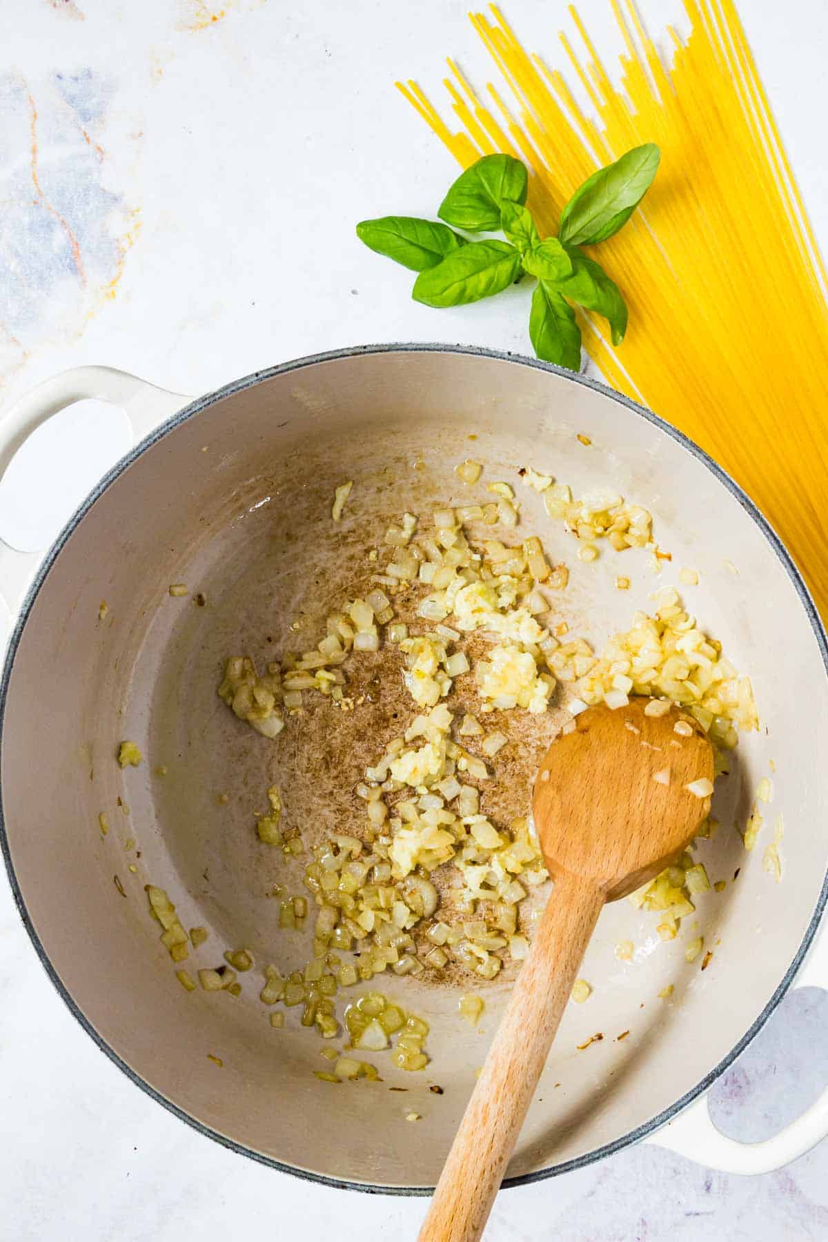 Sauteed onion and garlic in a pot.