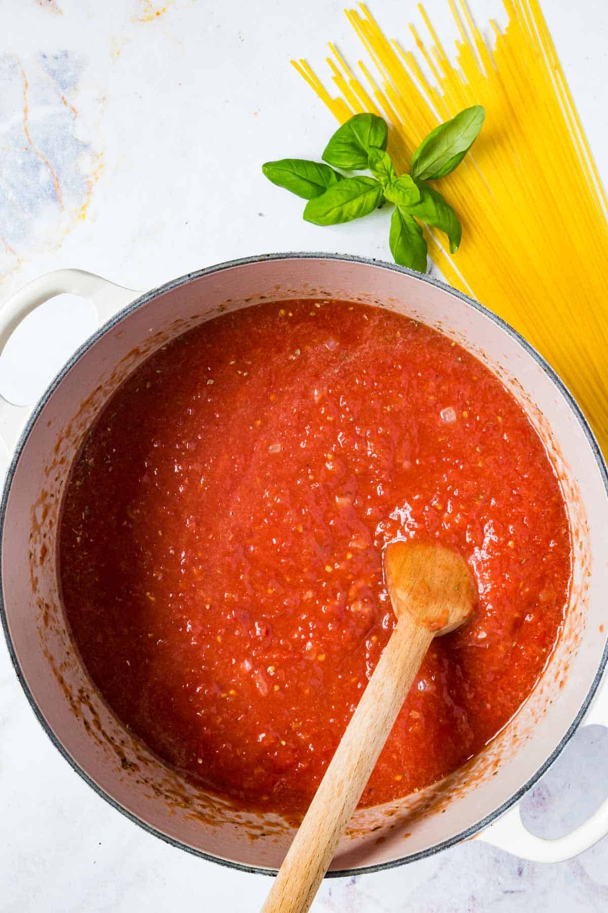 Marinara sauce simmering in a pot.