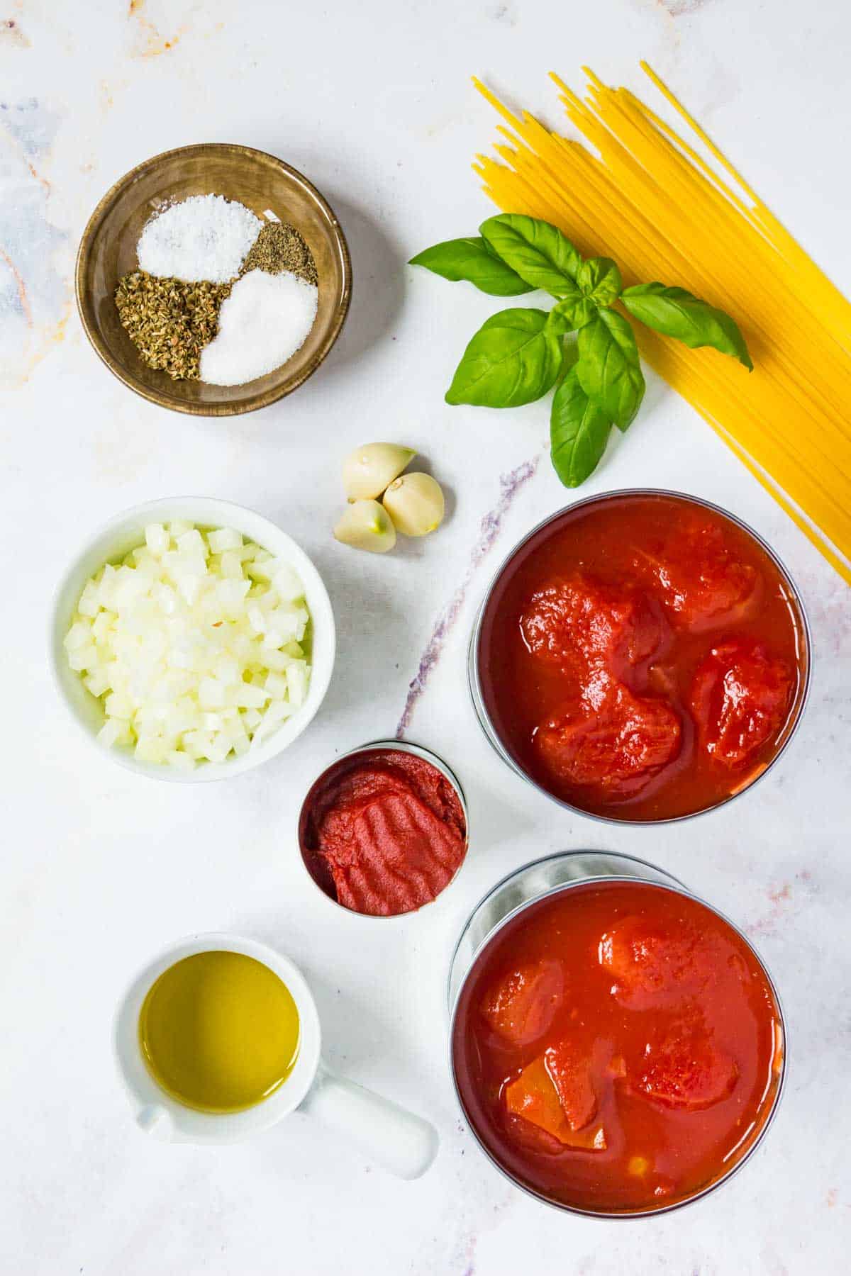 The ingredients for homemade marinara sauce.