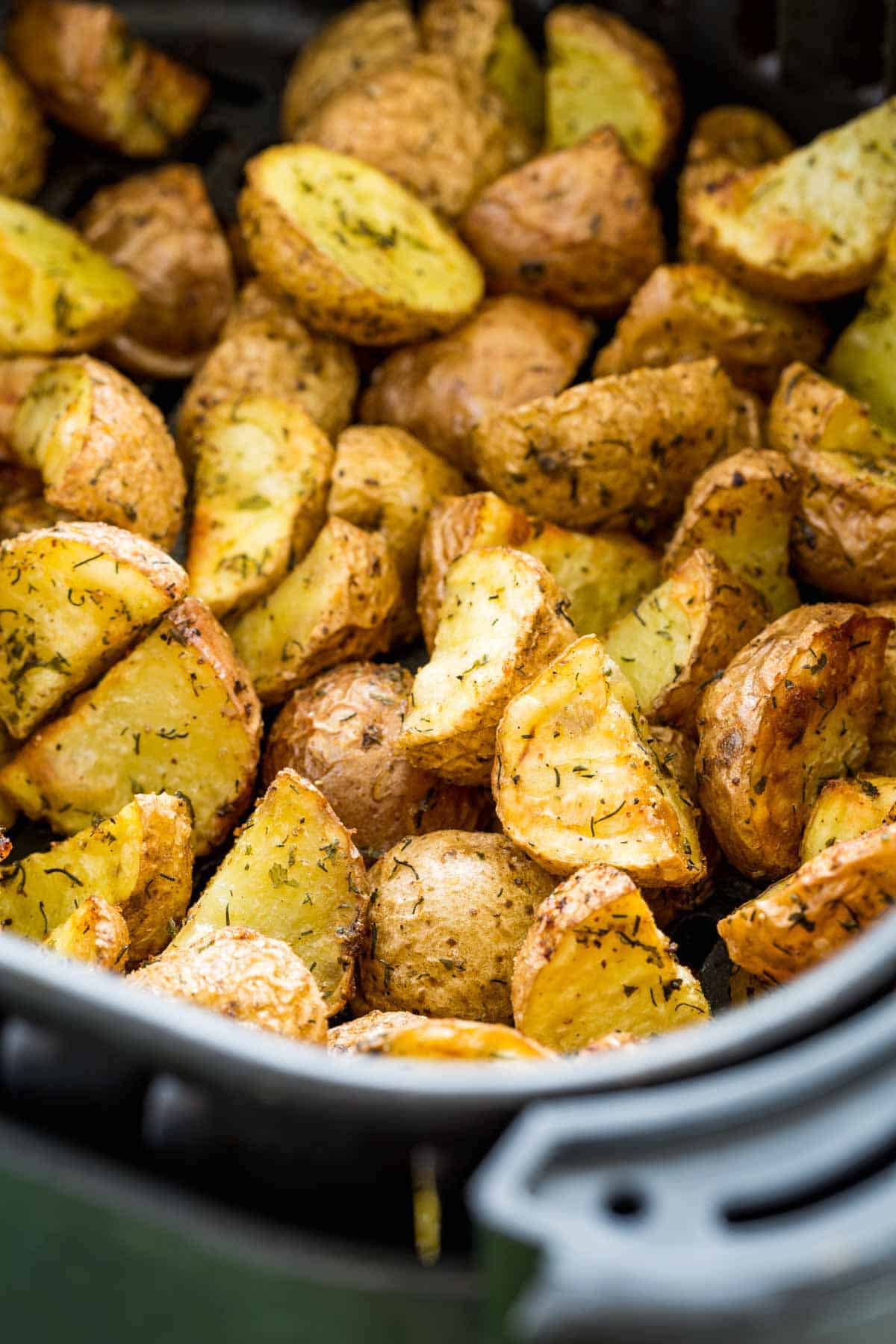 Ranch potatoes inside an air fryer.