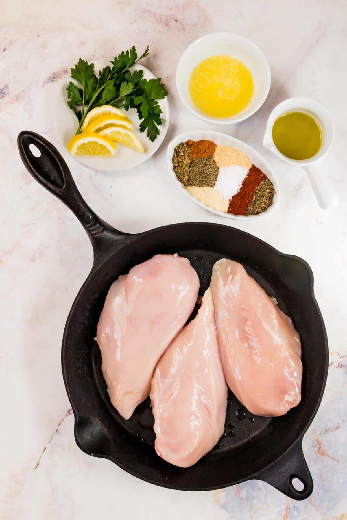 The ingredients for baked blackened chicken breasts.