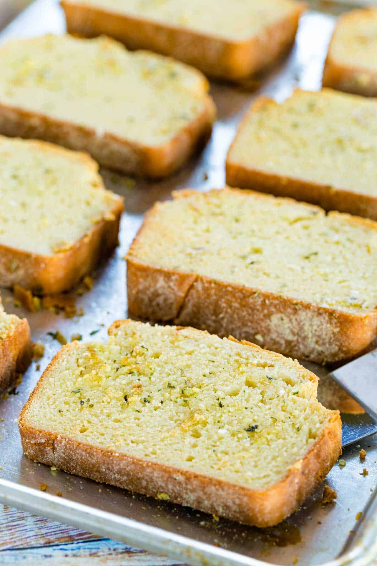 Rows of Texas garlic toast on a baking sheet.