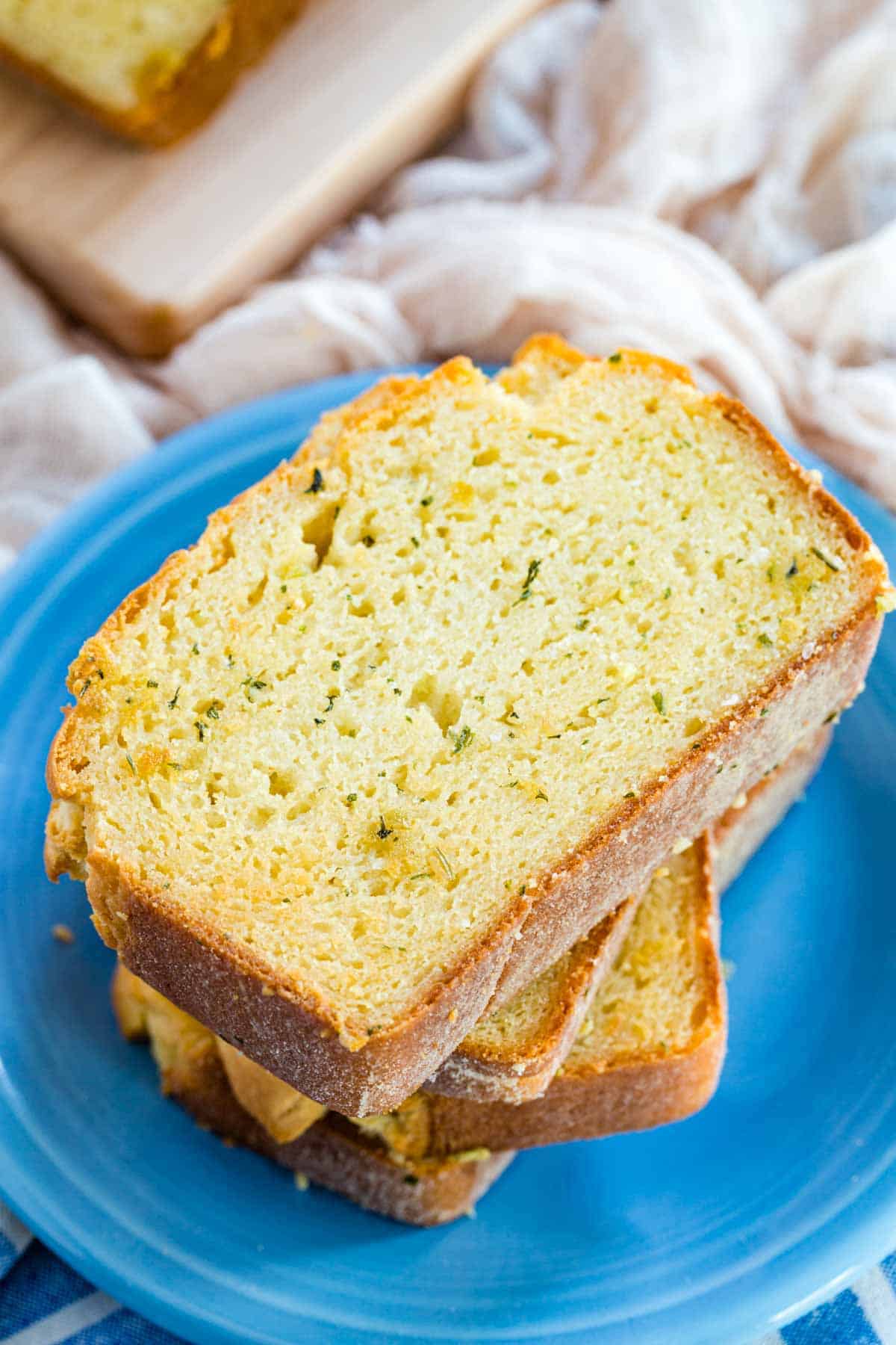 A stack of golden Texas garlic toast on a plate.