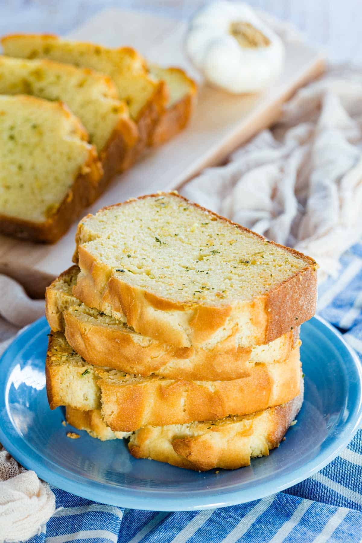 A stack of golden Texas garlic toast on a plate.