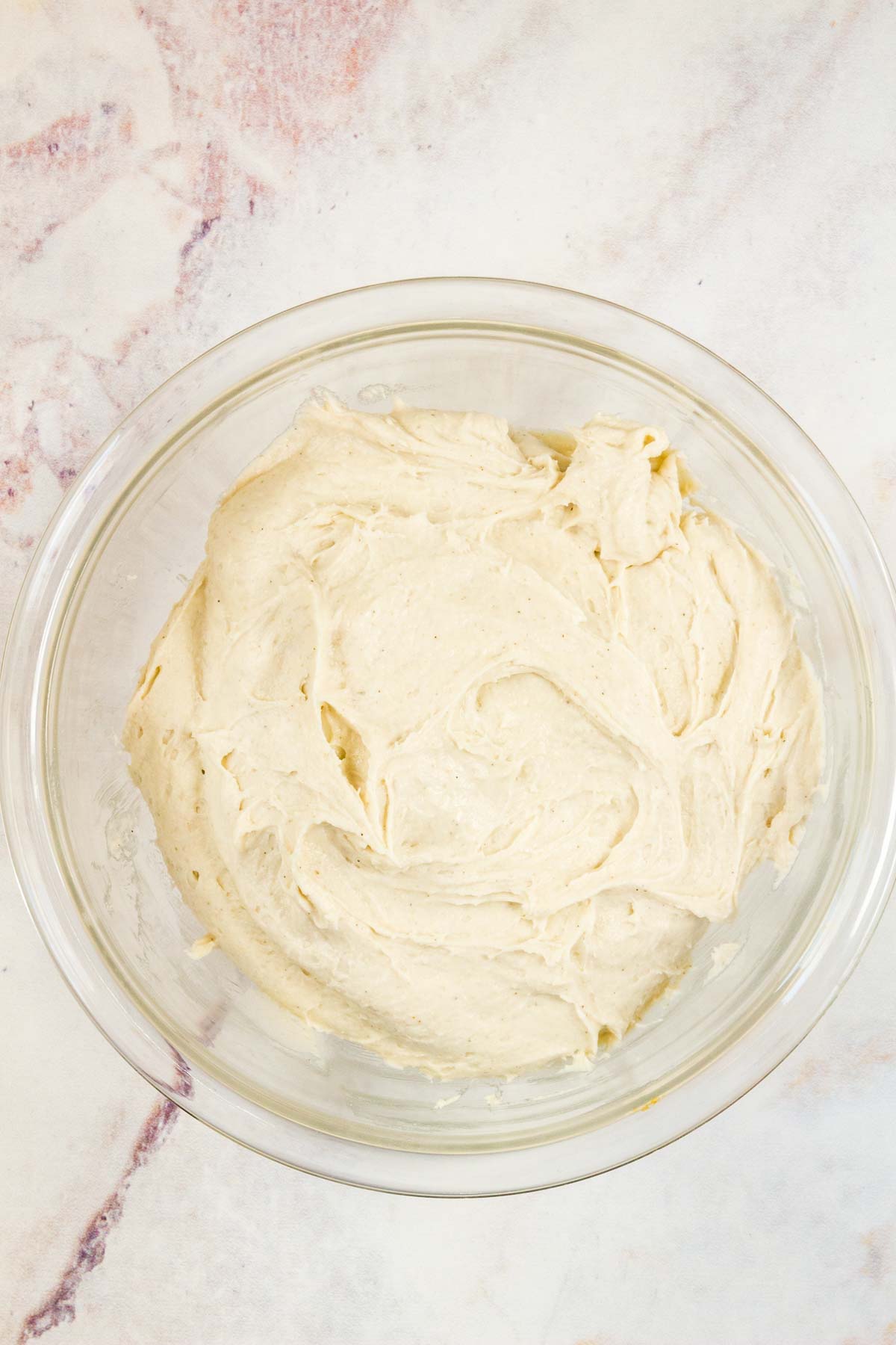 English muffin dough in a mixing bowl.