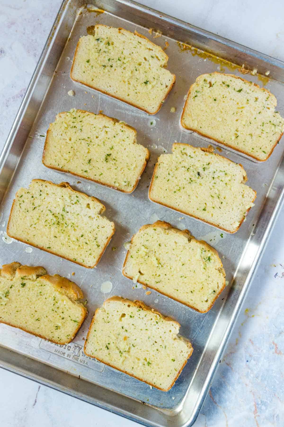 Rows of Texas garlic toast on a baking sheet.