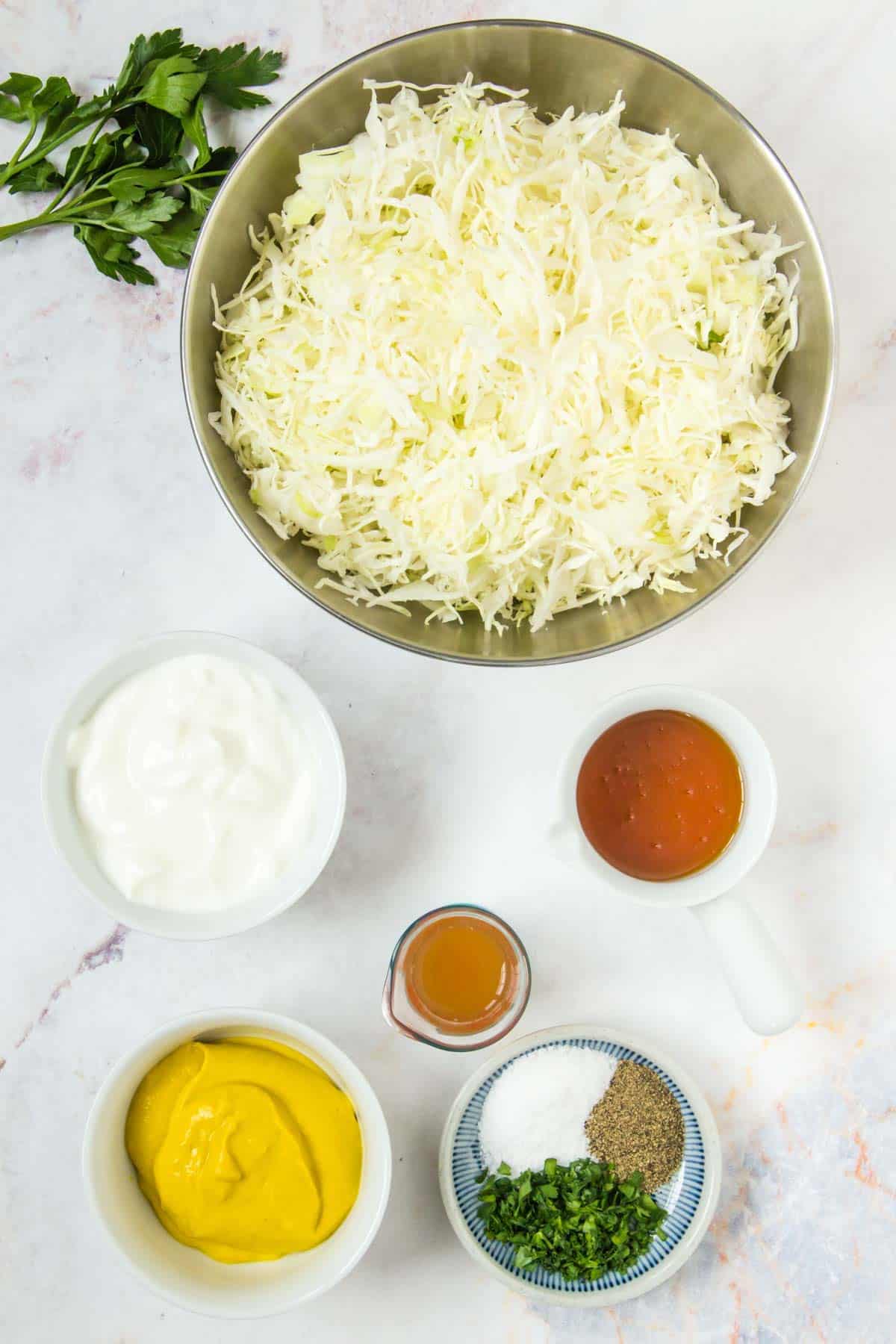 The ingredients for homemade mustard coleslaw.