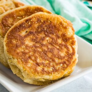 Homemade english muffins on a plate.
