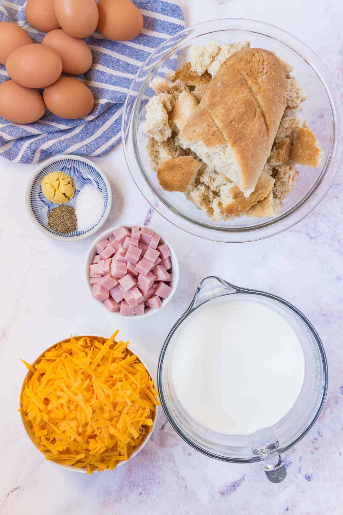 The ingredients for gluten free ham and cheese strata.