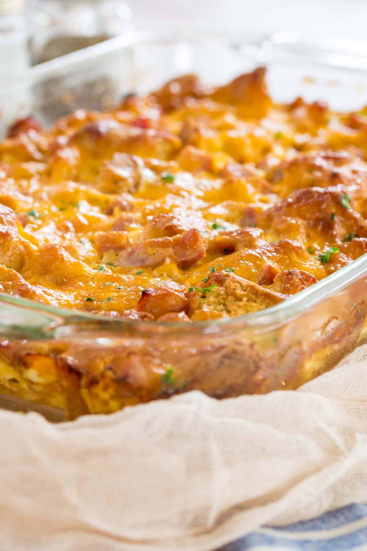 Gluten free ham and cheese breakfast casserole in a clear baking dish.