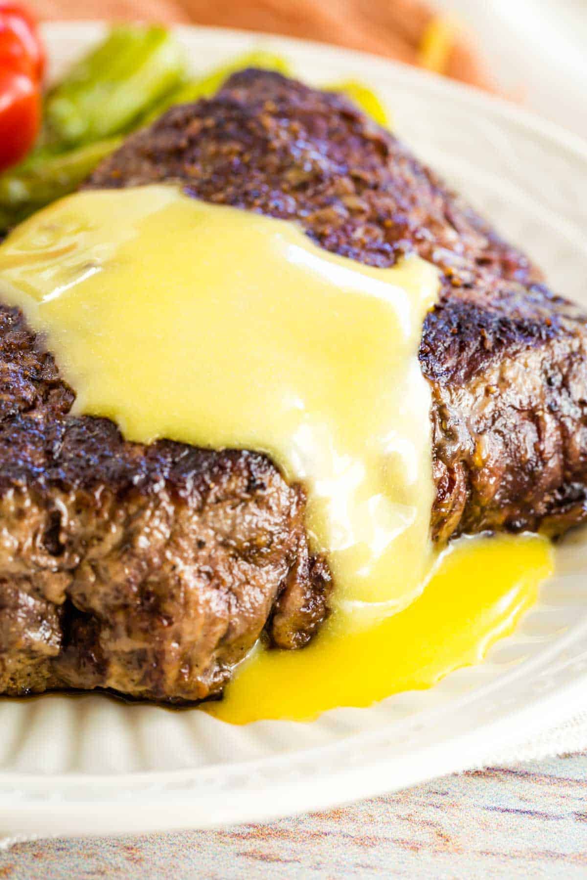 Steak covered in hollandaise sauce.