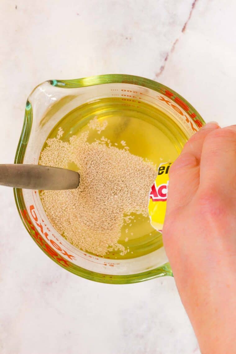 Active dry yeast is added to a mixture of honey and warm water.