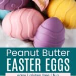 Closeup of pastel colored peanut butter eggs and some of the eggs in a parchment-lined box.