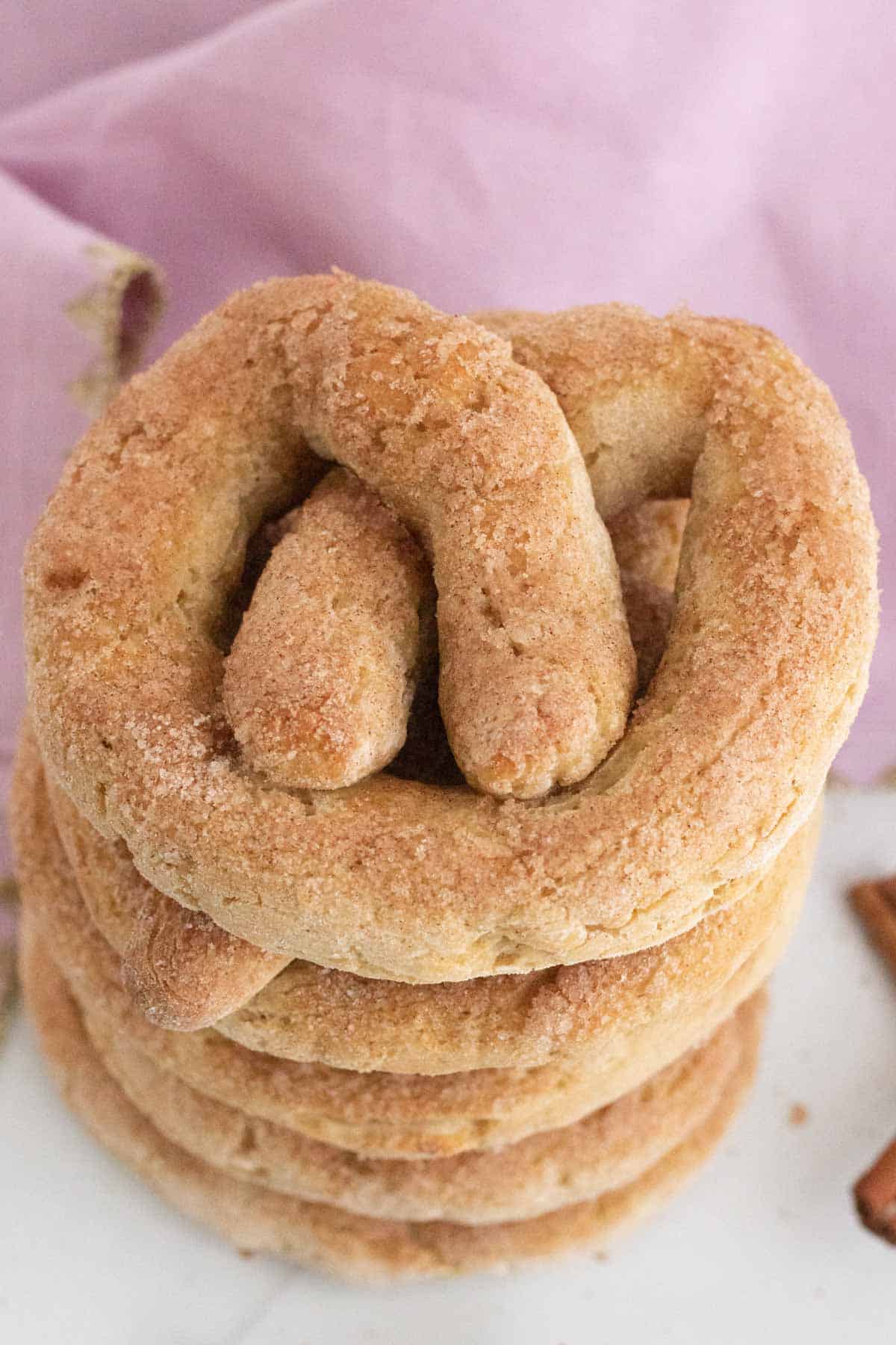 Looking down at cinnamon sugar soft pretzels stacked on top of each other.