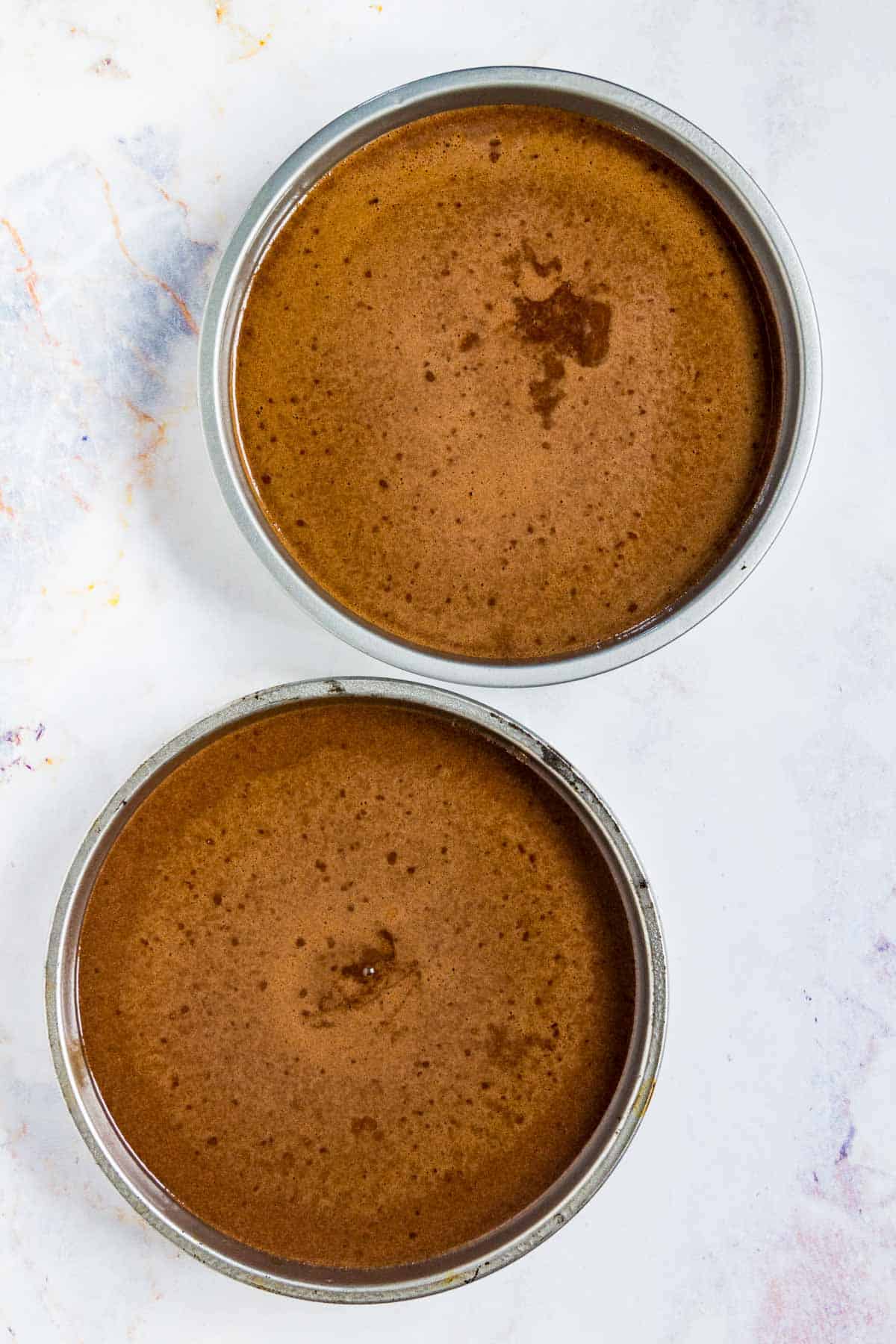 Two gluten-free chocolate cakes in 8-inch round pans.