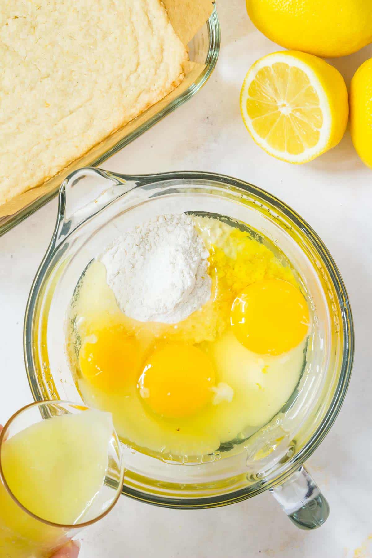 The ingredients for the lemon filling are combined in a mixing bowl.