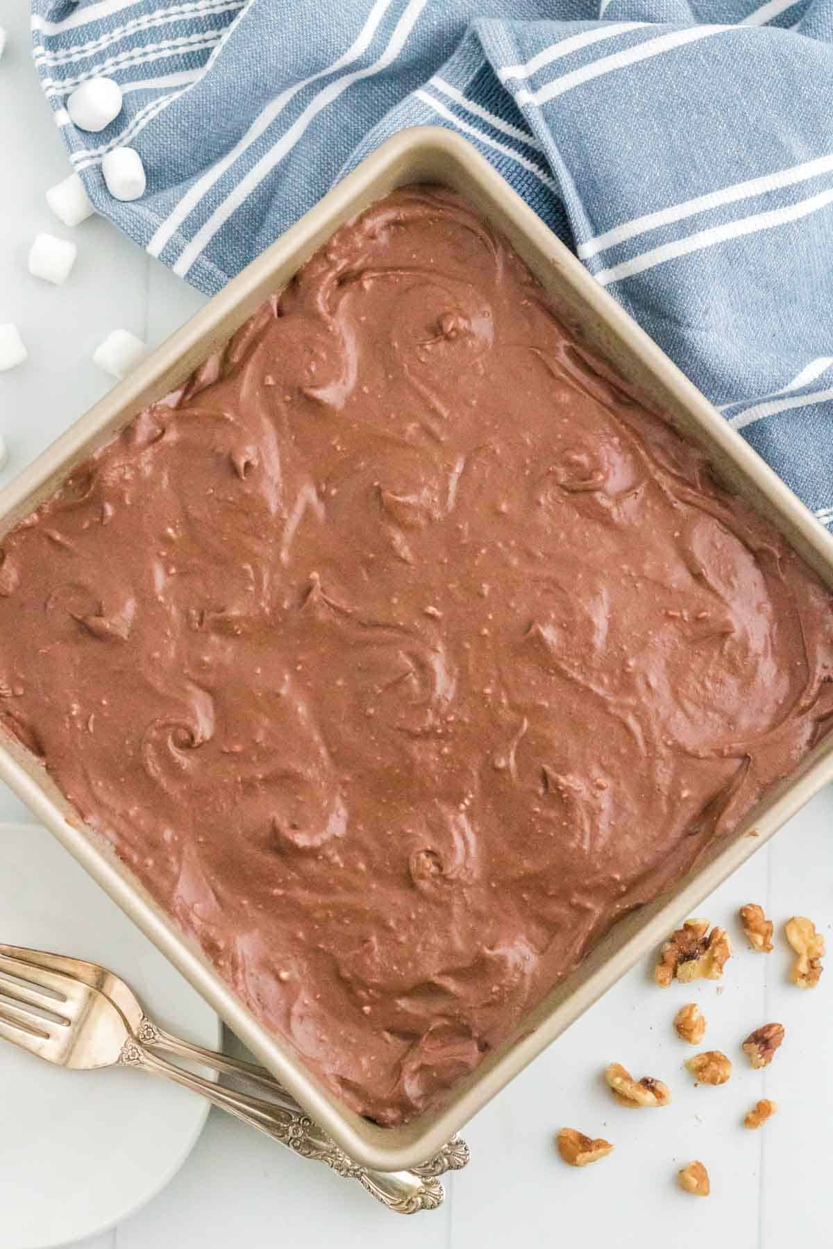 A pan of frosted rocky road brownies.