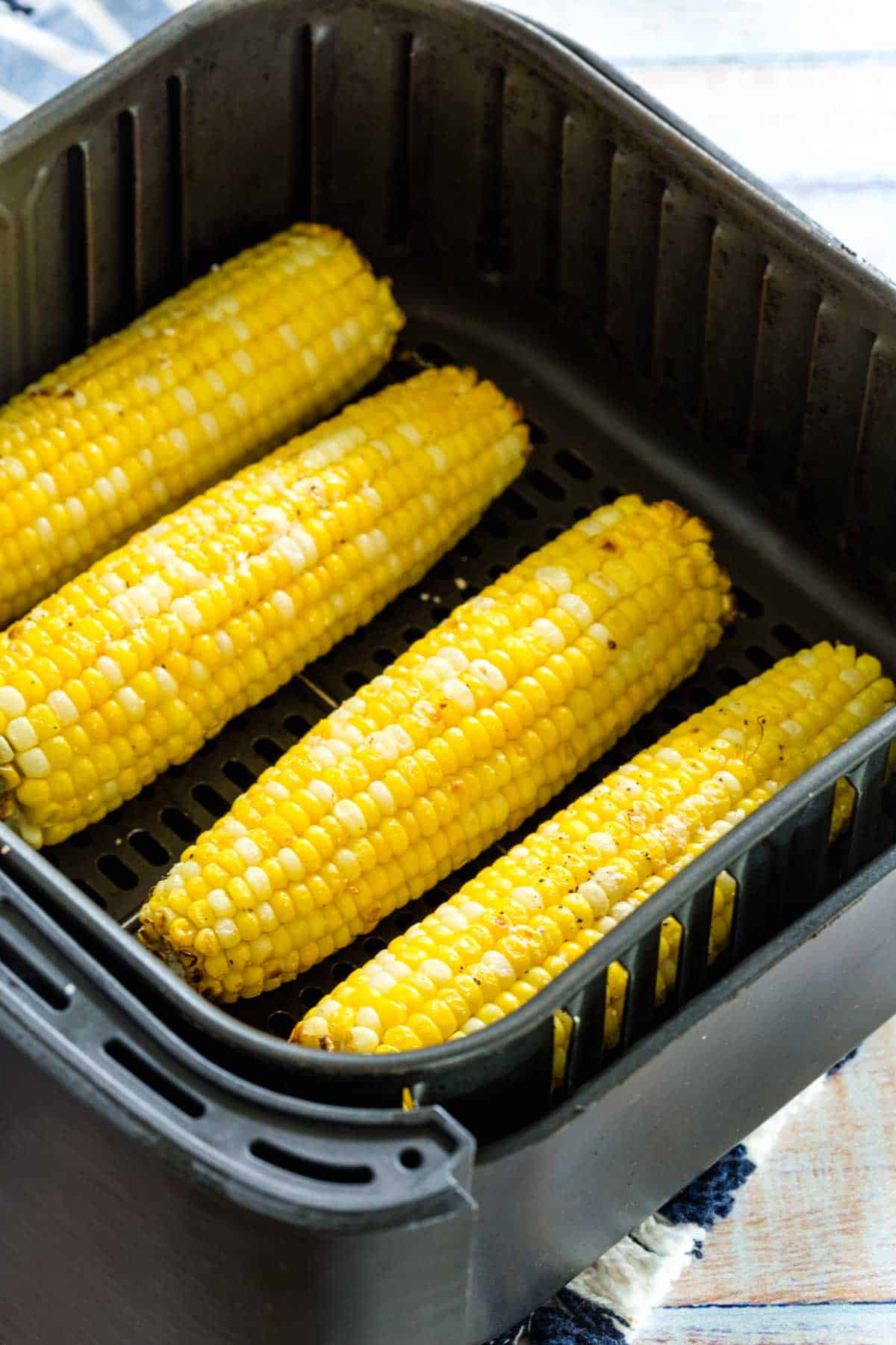 Corn on the cob inside the air fryer.