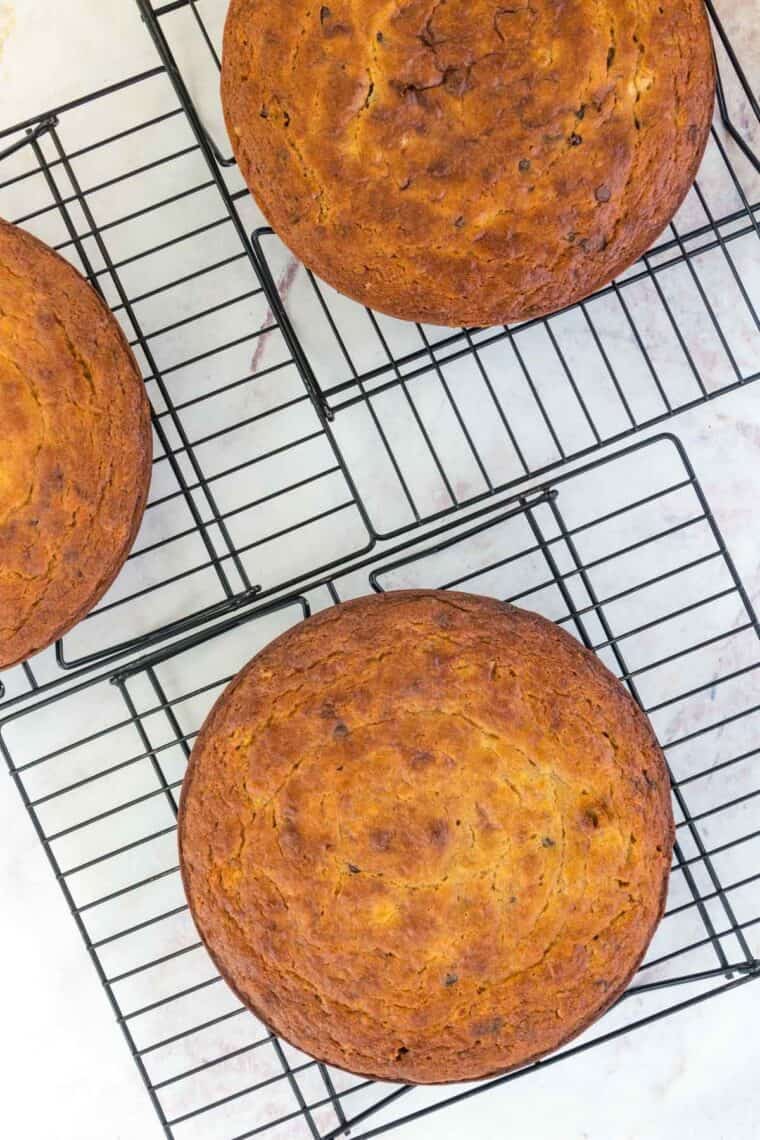 Banana cake layers fresh out of the oven placed on wire racks