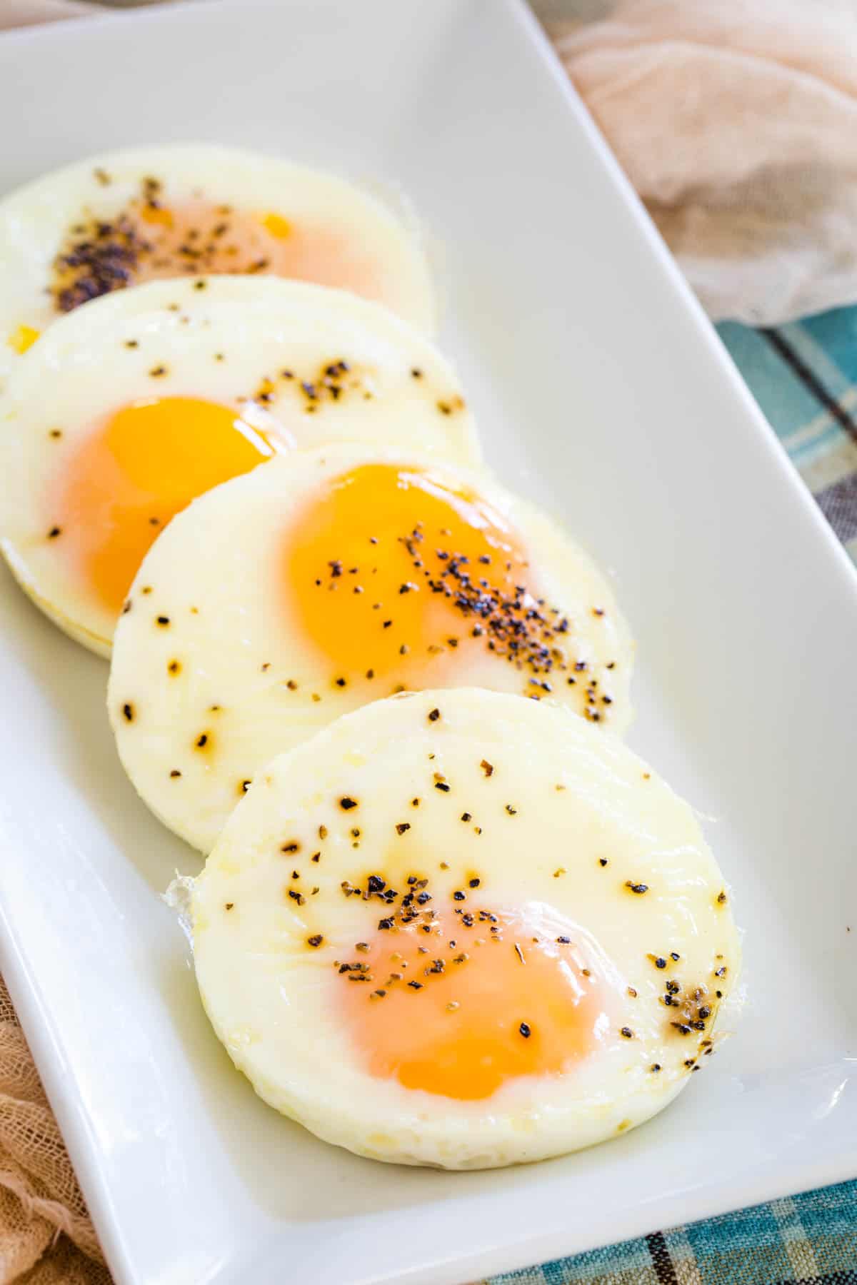 A rectangular platter of seasoned baked eggs.