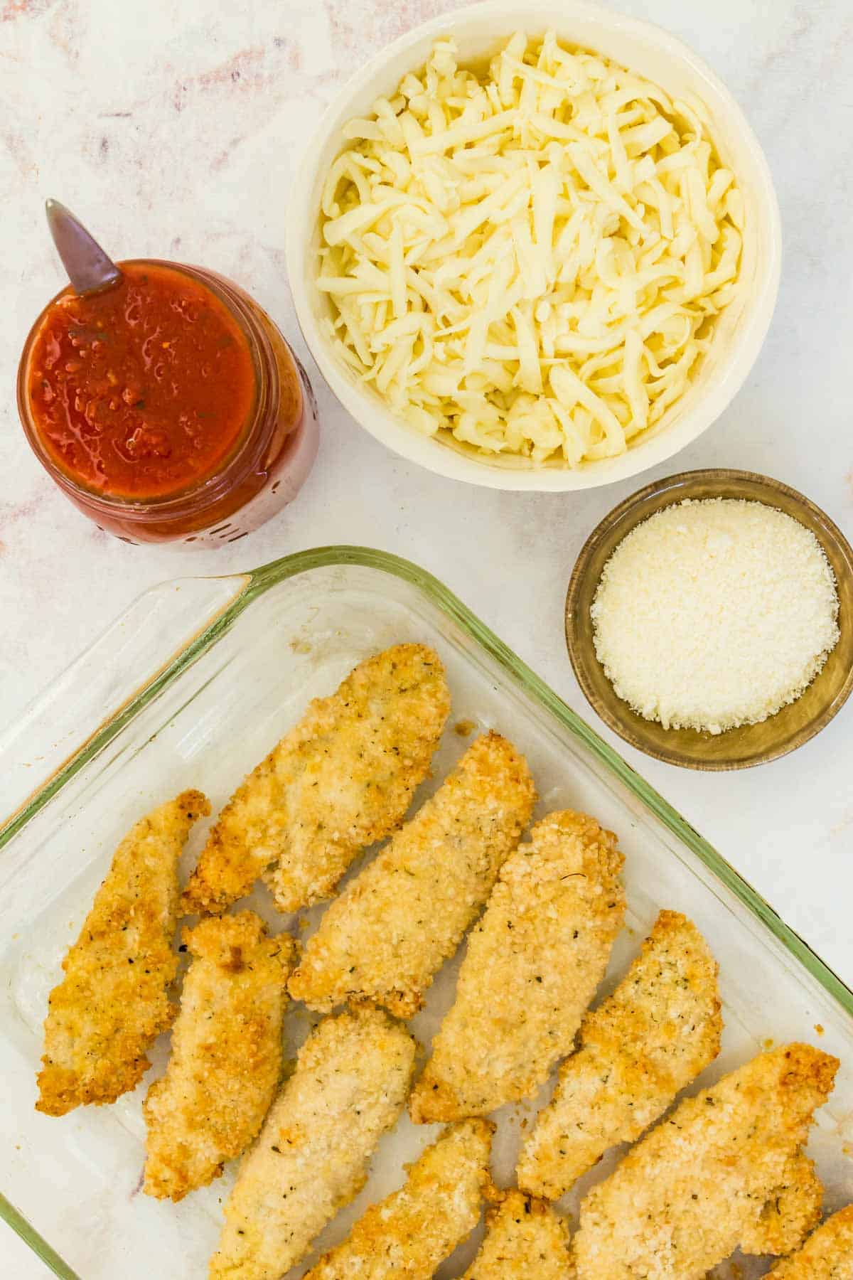 The ingredients for gluten free chicken parmesan.