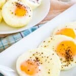 Bakes eggs on a white rectangular plate and a round plate.