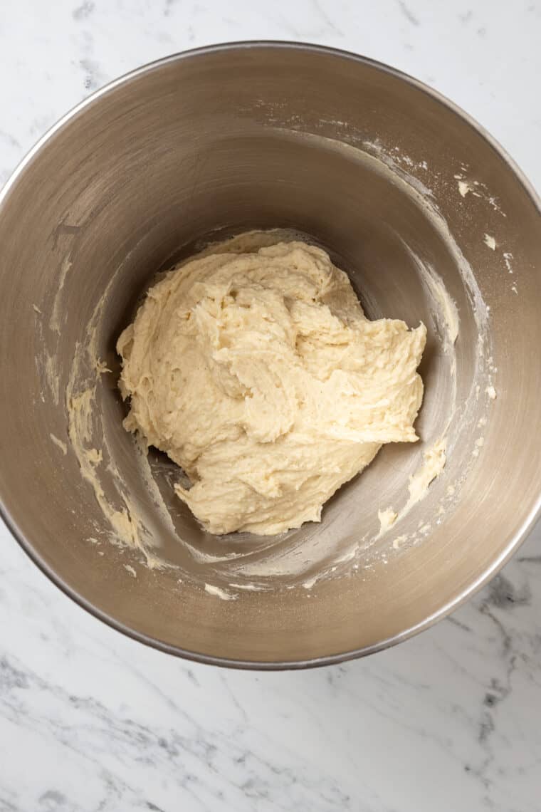 Gluten free crescent roll dough comes together in the bottom of a mixing bowl.
