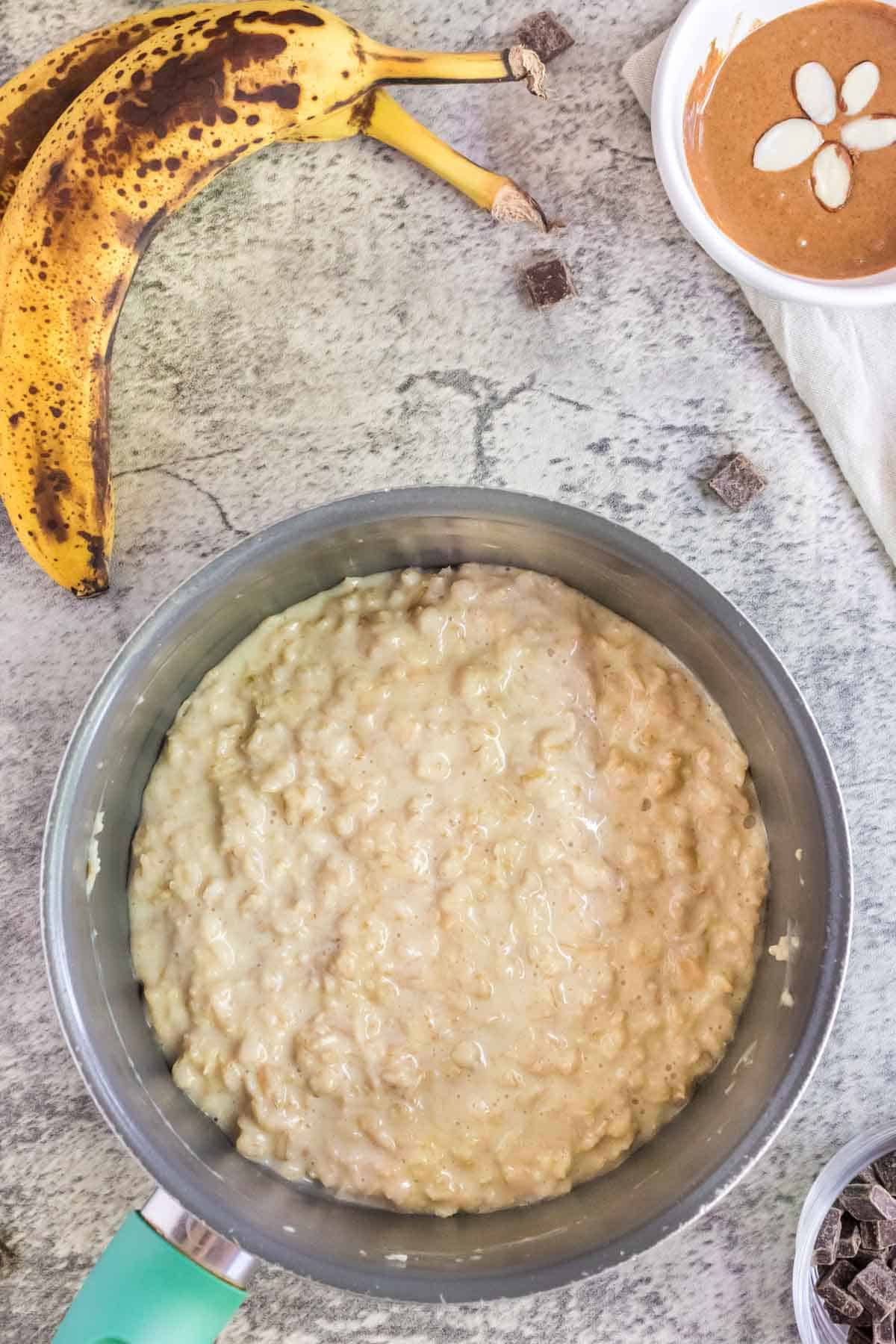Creamy cooked oats in a bowl on the counter.