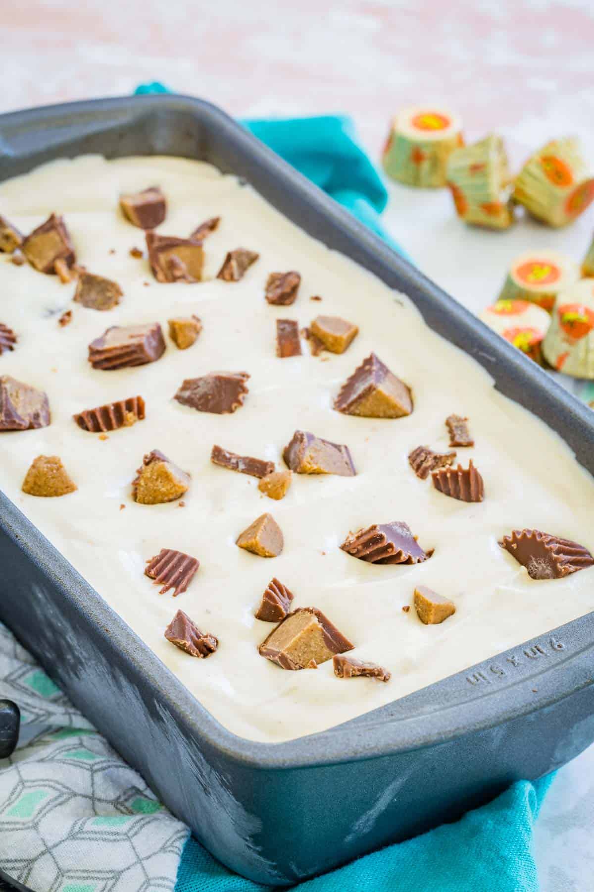 No-churn Reese's ice cream in a metal loaf pan.