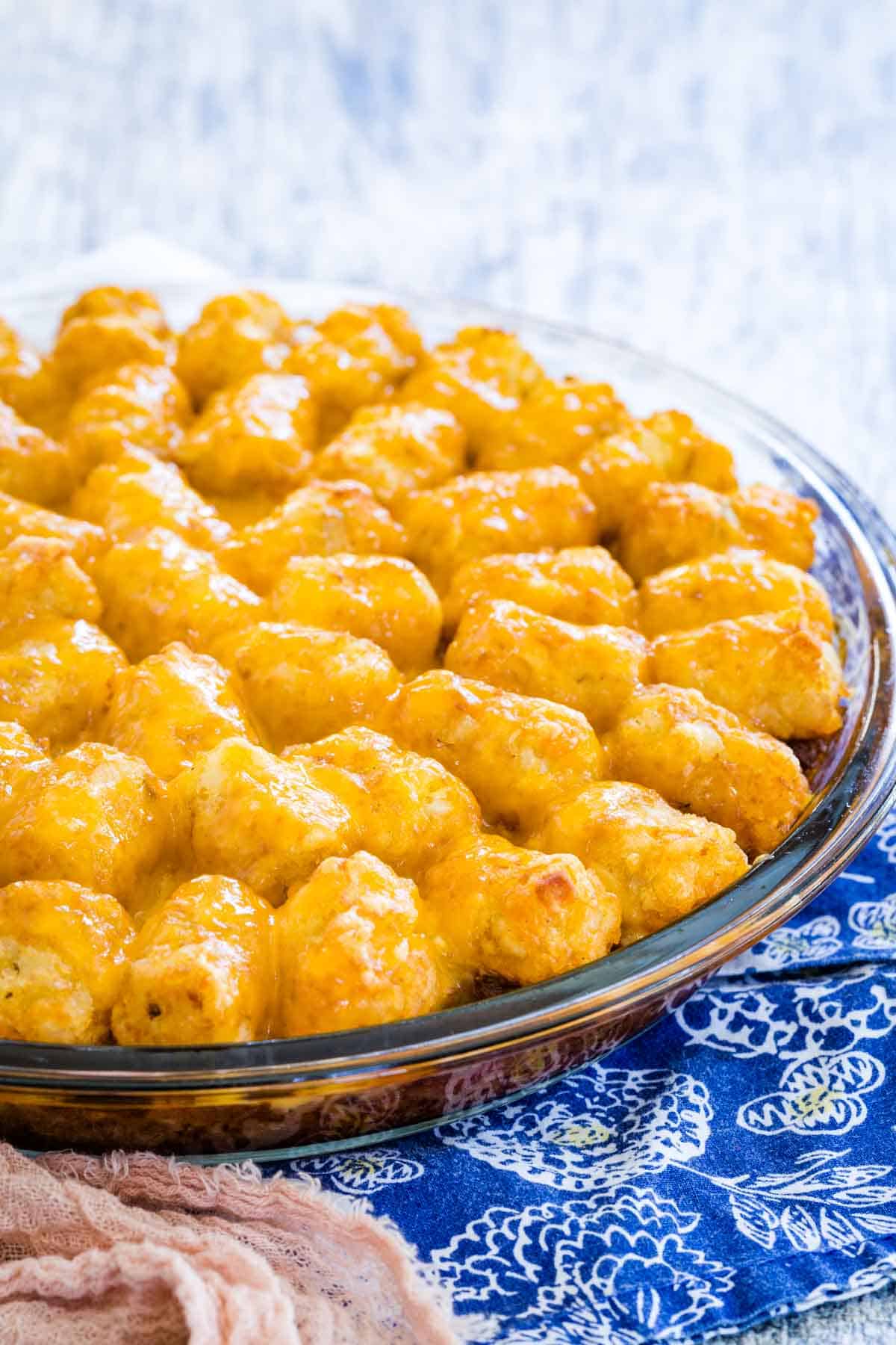 Sloppy joe tater tot casserole in a glass baking dish.